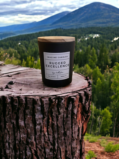 A candle rests on a stump overlooking the woods, embodying the essence of Rugged Excellence. The label reads 'Rugged Excellence', evoking the feeling of a long day and the comfort of a favorite cologne. Fragrance notes include petitgrain, cardamom, lemon, orange, fir, jasmine, rosemary, rose, lily of the valley, vetiver, musk, oak moss, and Brazilian rosewood."